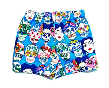 Pantalones con tela Frida calaveras turquesa